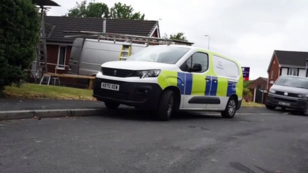 Police at the scene of a fire in Wigan