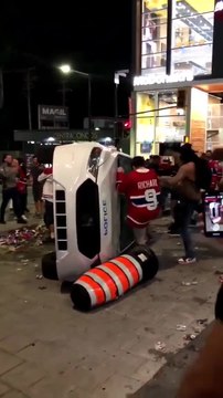 Habs fans flip over a police car after Game 7 win on June 24