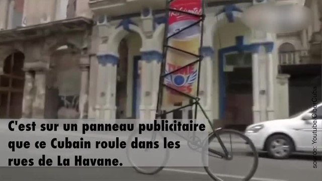 Il roule sur un vélo géant pour faire la publicité des entreprises