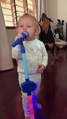 baby and dog doing same thing