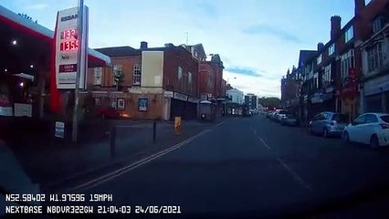 Two Cars Speed Past Car on Slow Street