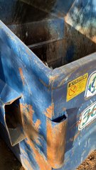 Man Helps Rescue a Raccoon Stranded in Dumpster