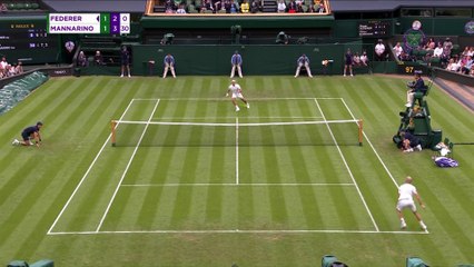 Federer advances after Mannarino retires injured