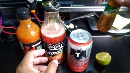 cerveza tecate bien fria con clamato limon y salsa picante deliciosa bebida para el calor de verano