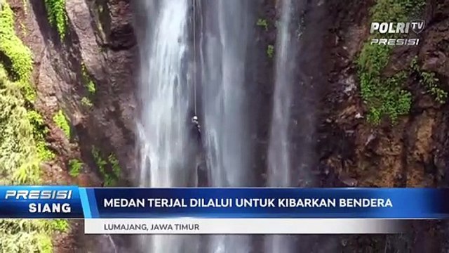 Polres Lumajang Kibarkan Bendera Merah Putih di Air Terjun