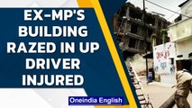 UP: Former MP's building razed, rubble falls on driver operating excavator | Oneindia News