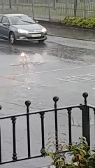 Descargar video: Manhole cover blown out on busy Derry thoroughfare amid thunder storm