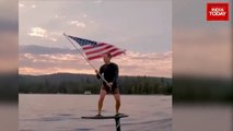 Facebook CEO Mark Zuckerberg celebrates US Independence Day by waving American flag on surfboard