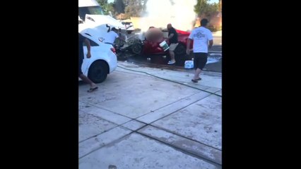 Videos show neighbors trying to extinguish car fire