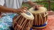 Performing Artist Plays Indian Hand Drums on Open Roof Terrace