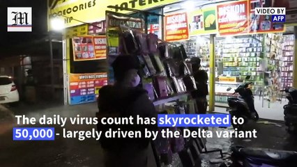 Indonesia uses fire engine water jets to enforce Covid-19 restrictions