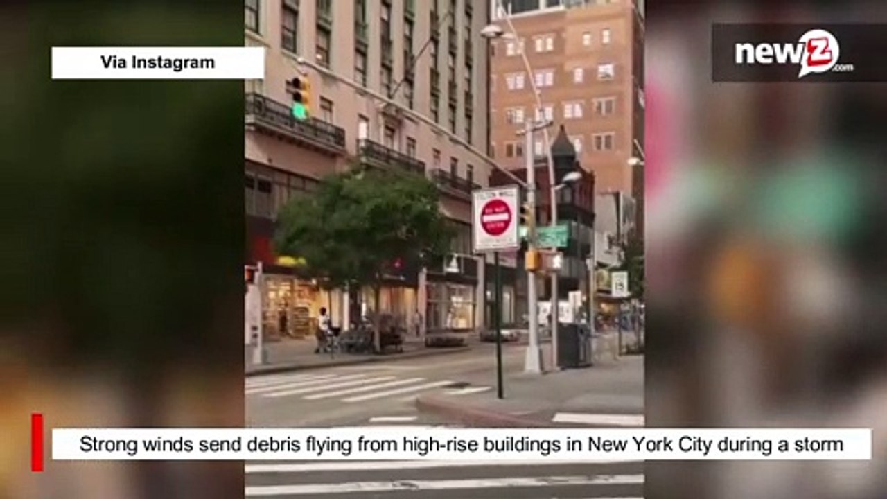 Strong winds send debris flying from high-rise buildings in New York City during a storm