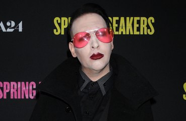 Why did Marilyn Manson turn himself in to police?