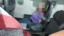 Havada panik anları! Uçağın kapısını açmaya çalışan kadını, koli bandıyla bağladılar