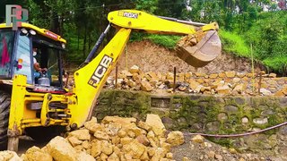JCB Backhoe Loader Throwing Up A Big Big Stone From Road Side To Construction Area-JCBVideo|Roadplan