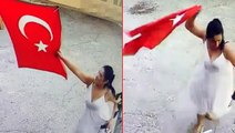 İş yerine asılı Türk bayrağını koparıp çöpe atan kadın kameralara yakalandı