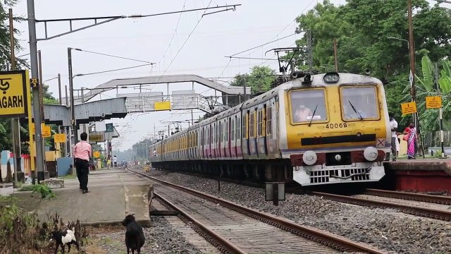 Adi Dhakeswari printed Aerodynamic faced EMU Local train arriving & departing from Balagarh __ IR