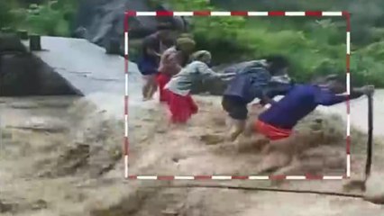 People risk lives as they cross roaring river