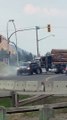 Loaded Logging Truck Towed By Powerful Pickup Truck