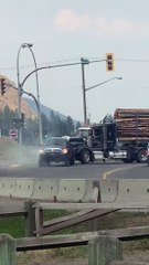 Loaded Logging Truck Towed By Powerful Pickup Truck