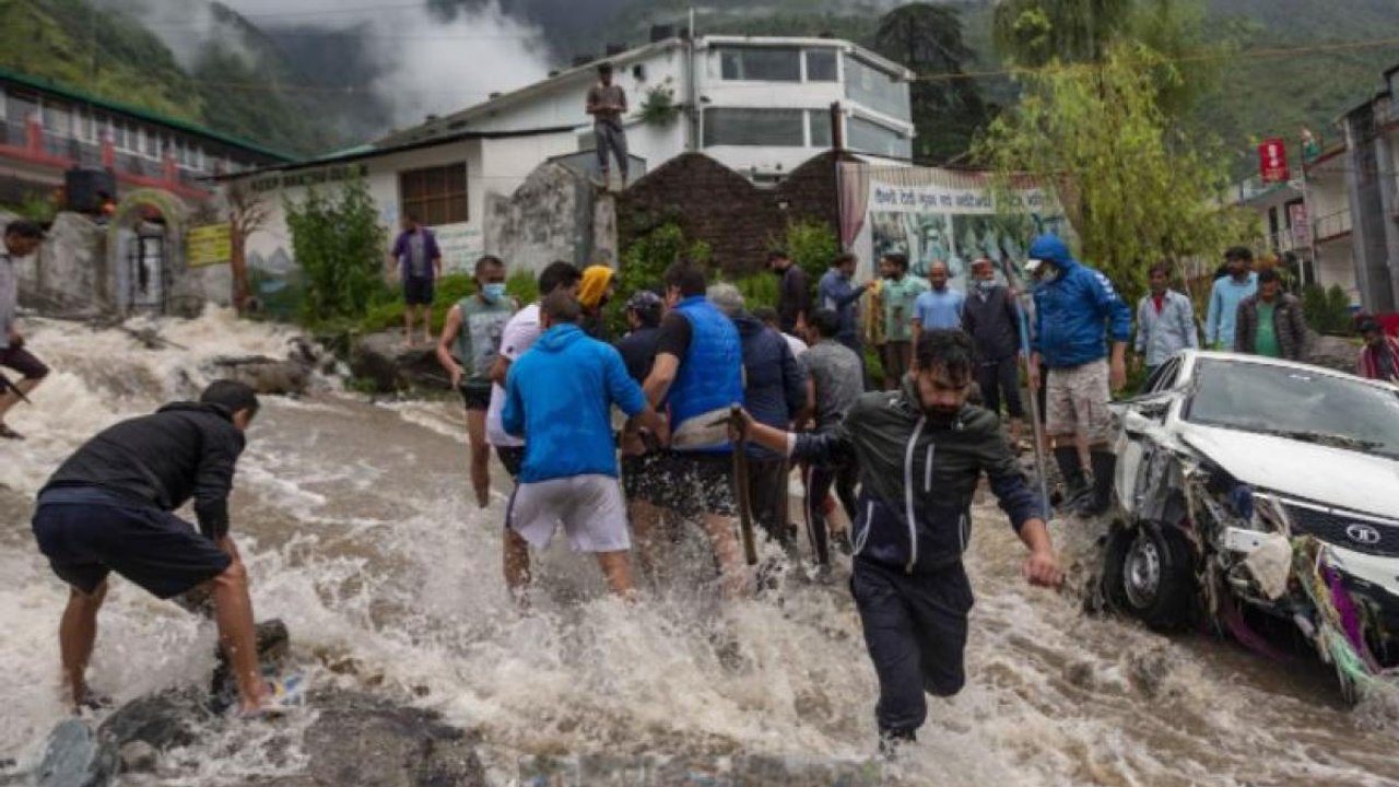 Cars washed away, house damaged as flood hits t...