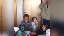 Siblings meet new baby brother