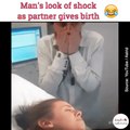 Man's look of shock as partner gives birth