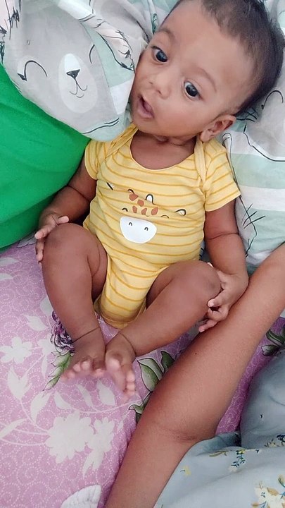 Discovering his toes and fingers