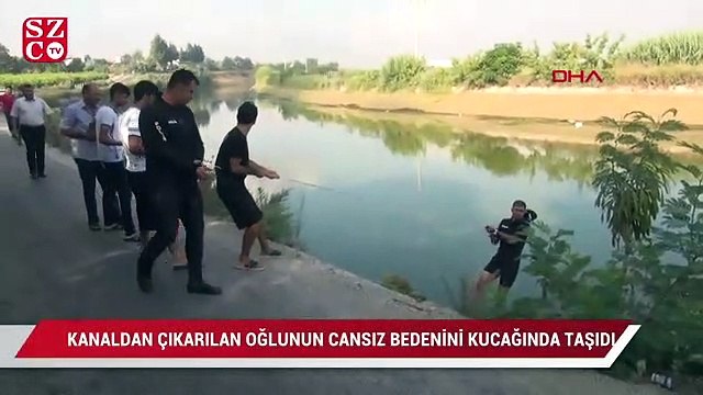 Kanaldan çıkarılan oğlunun cansız bedenini kucağında taşıdı