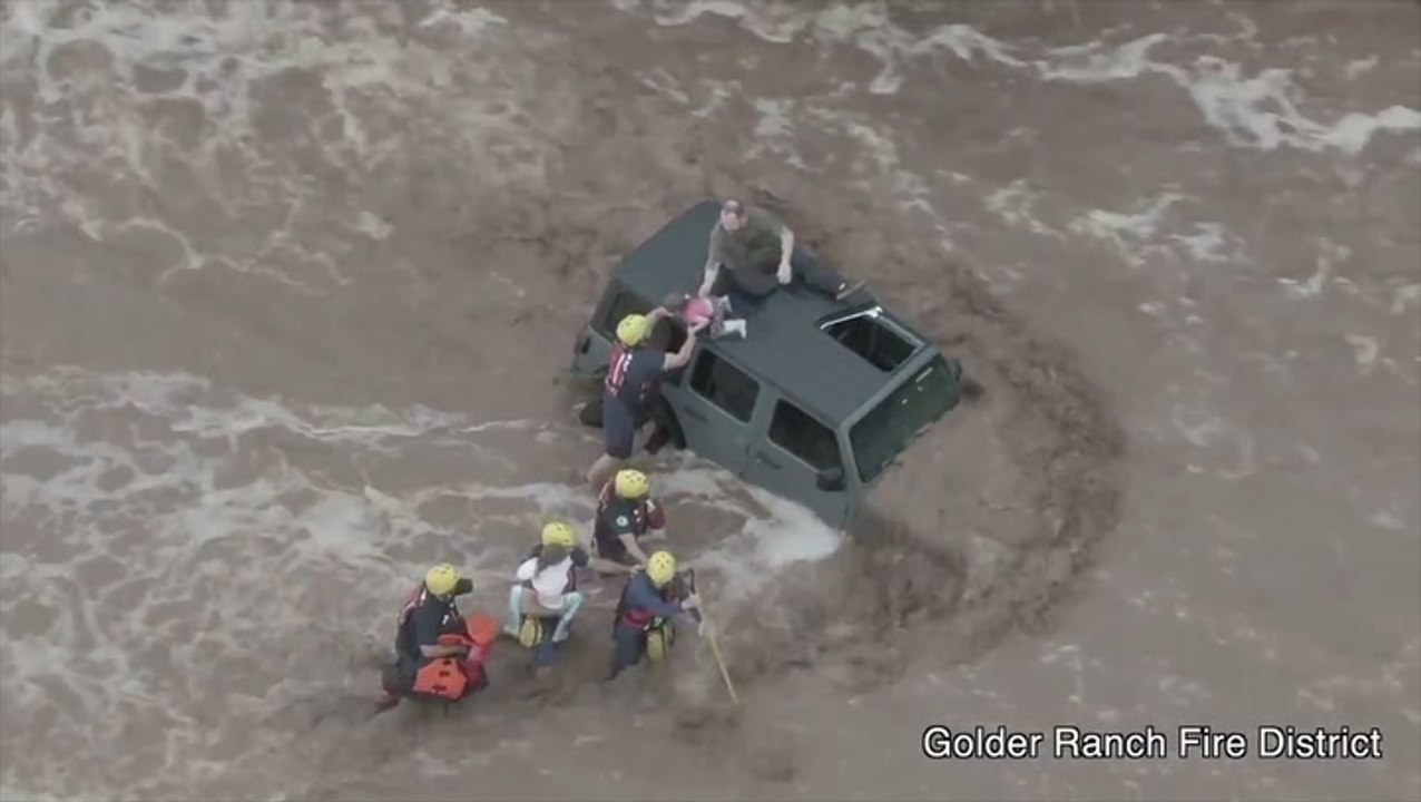 3 rescued from car surrounded by flash flooding