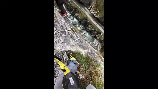 Group of Climbers Scale Cliffside