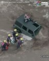 Dramatic footage shows firefighters rescuing a dad and his two young daughters from the roof of their car during flash floods in Arizona