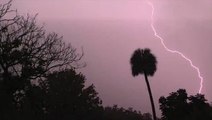 Massive lightning bolts accompany storms striking the Gulf Coast