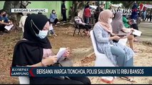 Polda Lampung bersama Warga Tionghoa Bagikan Sepuluh Ribu Bansos Pada Warga Terdampak Covid 19