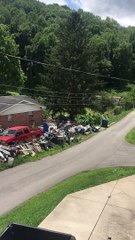 House Blocked by Mountain of Junk