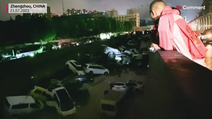 Flood aftermath: Pile up of cars on road in China