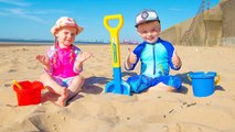 Gaby and Alex playing on the Beach with Sand and other Kids Toys