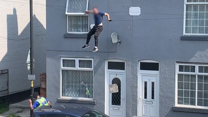 Shocking moment man falls from roof while evading police during cannabis raid