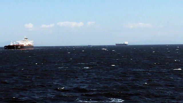 Giant cargo ship passing very close