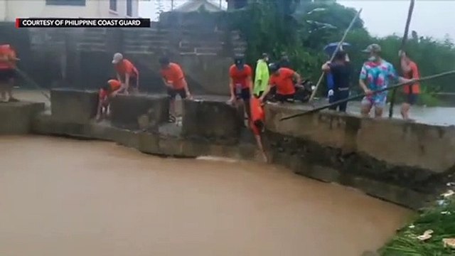 Coast Guard removes garbage blocking flow of floodwater
