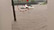 Rajkot: Car swept away in flooded water|VIDEO