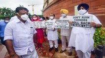 Oppn protest with banner- posters outside the Parliament