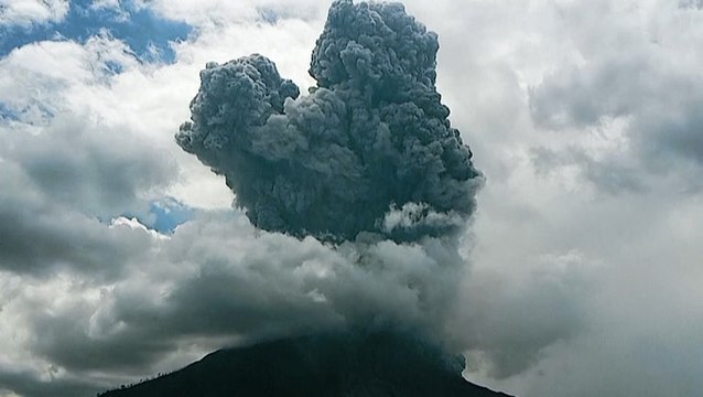 Indonesian volcano erupts sending ash towering into the sky