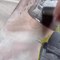 Person Varnishes Oil Painting Using Sealing Liquid And Brushes It Over Their Art