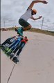 Guy Wearing Rollerblades Performs Superb Skating Trick by Jumping Over 4 People Lying on Road