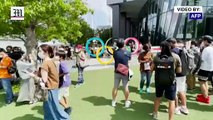 Tokyo’s Olympic rings draw crowds despite rising Covid cases