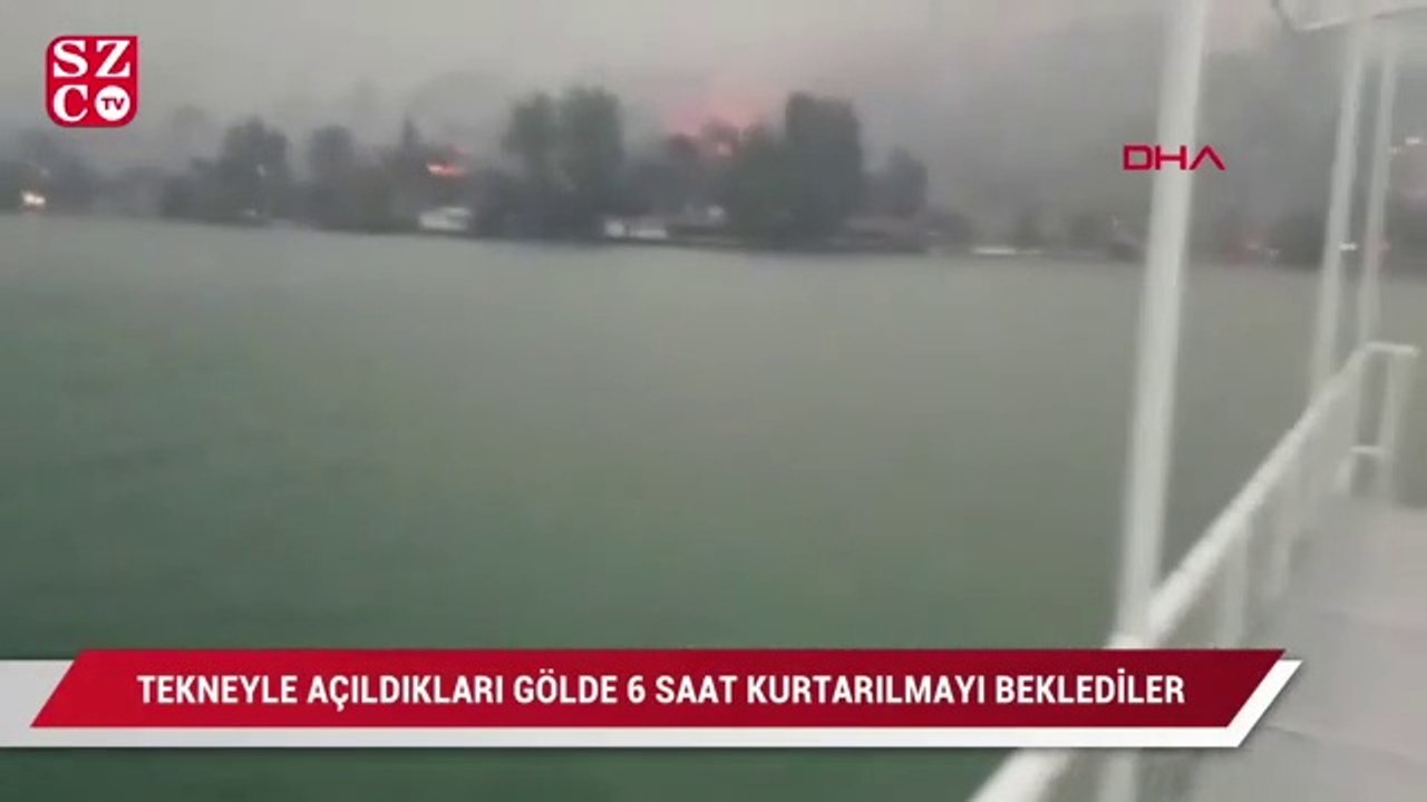 Yangından kaçarken tekneyle açıldıkları gölde mahsur kaldılar