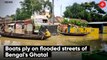 Boats ply on flooded streets of Bengal's Ghatal