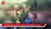 Delikyol'da vatandaşlar elleriyle yangını söndürmeye çalışıyor