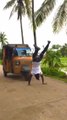 Guy Pulls Auto-Rickshaw With Rope While Walking in Handstand Position